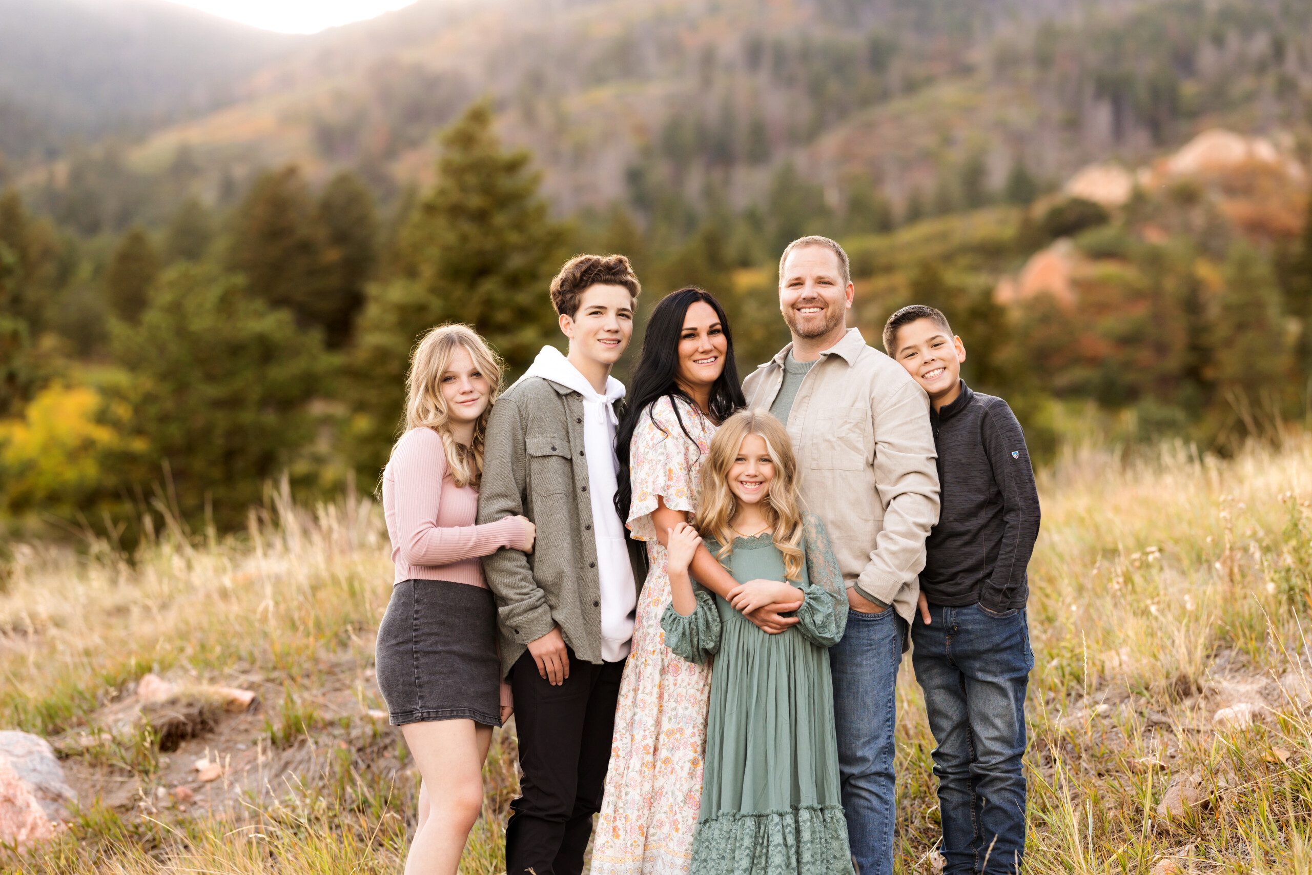 Family of six standing at Ute Valley Park in Colorado Springs for their family portrait photo session
