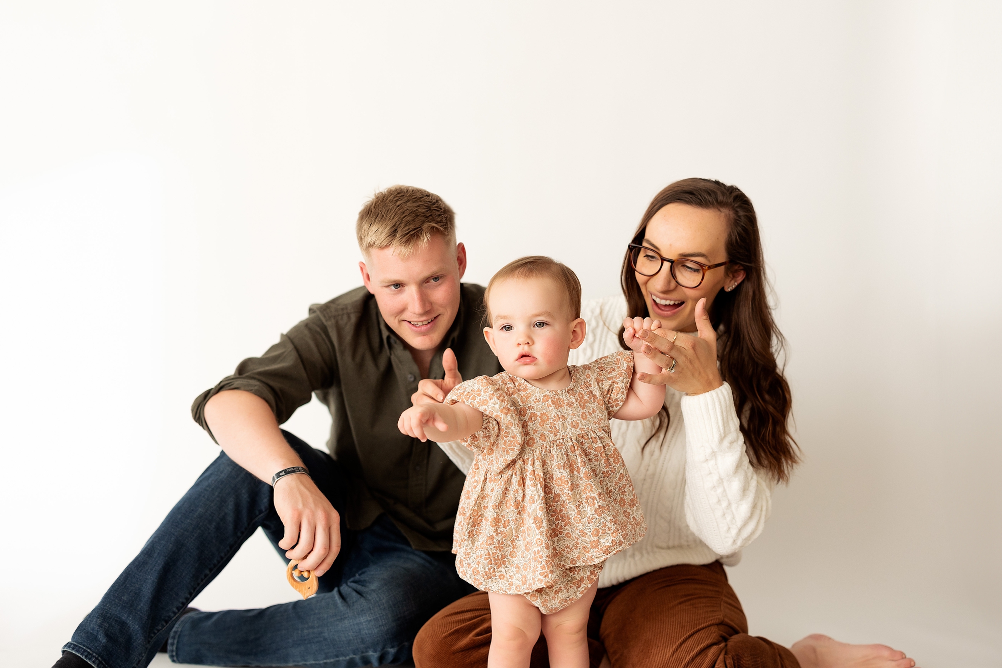 studio photos in Colorado Springs at kindle studio of a baby girl on her first birthday with mom and dad